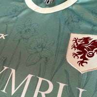 Cymru Cennin Pedr Third Football Jersey woven crest detail soft green performance fabric available @ asphaltsocialklub.com