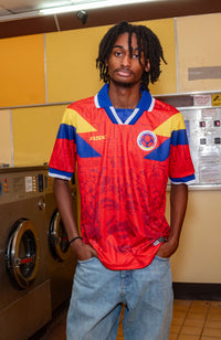 El Pibe Loco Away Football Jersey red Colombia retro style relaxed fit on model available @ asphaltsocialklub.com